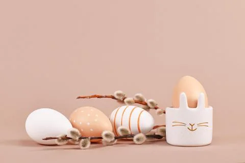 Simple natural colored Easter eggs with stripes and dots with bunny shaped egg Stock Photos