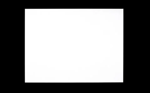 Simple old rectangle empty blank bright white TV screen in a dark room, front Stock Photos