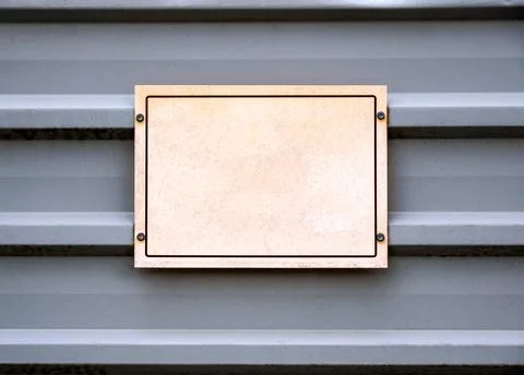 Simple one single worn blank empty sign on a metal construction site fence Stock Photos