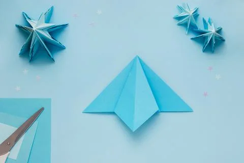 Simple origami 3D Christmas tree made from blue paper. Step by step instruction Stock Photos