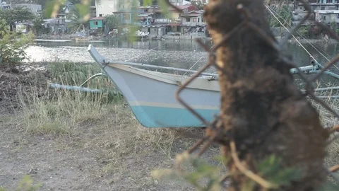 Simple pan shot of small boat called bangka in Olongapo City Philippines Stock Footage 125497773