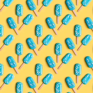 Simple pattern blue mint ice cream popsicles on yellow background. Tasty and  Stock Photos