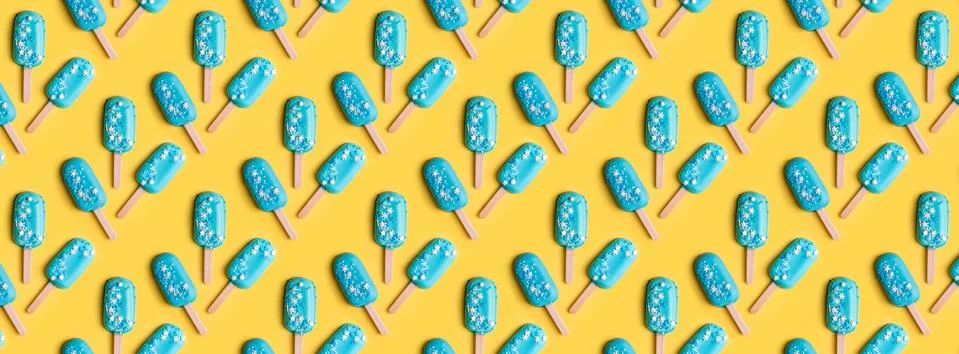 Simple pattern blue mint ice cream popsicles on yellow background. Tasty and  Stock Photos