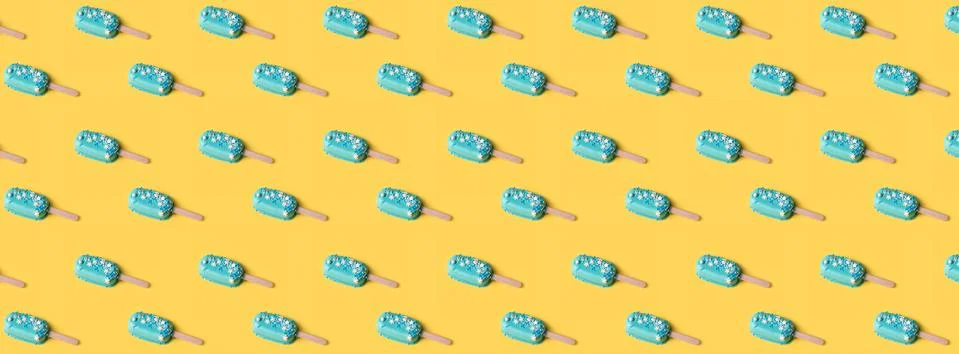 Simple pattern blue mint ice cream popsicles on yellow background. Tasty and  Stock Photos