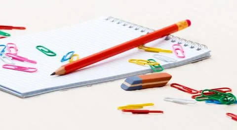 Simple pencil Notebook paper clips on a desk Stock Photos