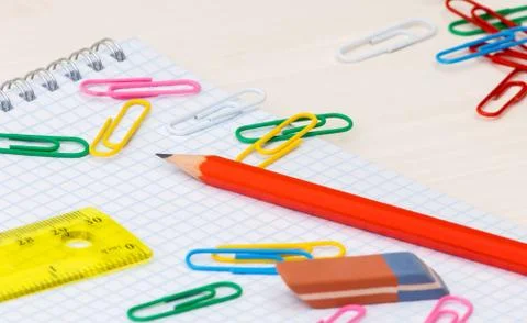 Simple pencil Notebook paper clips on a desk Stock Photos