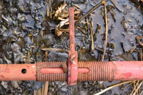 Simple photo background composition image of metall valve in the swamped pond Stock Photos