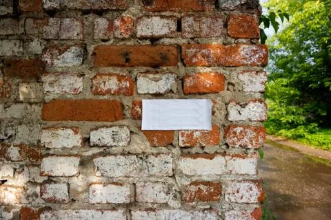 Simple photo background pattern of clear sheet on red brick wall fragment wit Stock Photos