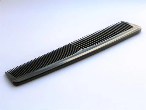 Simple plastic comb on white background Stock Photos
