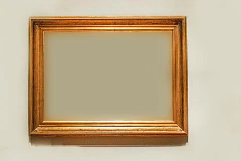 Simple profiled gilded wooden frame. Stock Photos