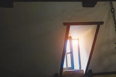 Simple rectangular attic window inside the building Fotos de archivo