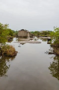 Simple reed mat homes of poor fishermen in wetlands of Benin Stock Photos