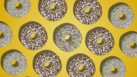 Simple rotation pattern of white glazed donuts on yellow background. Stock Footage 196484815