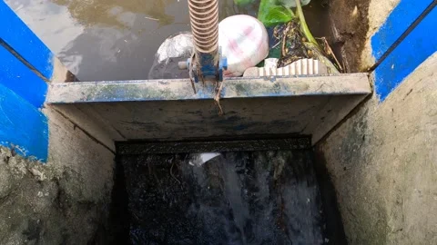 Simple Sewer Irrigation System Pond With Waste Garbage And Iron Handle Control Vidéo 152863552