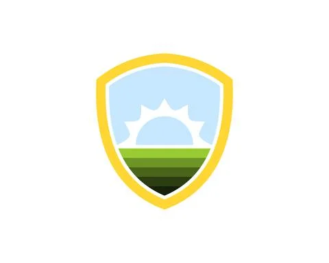 Simple shield with green field and sunset behind Stock Illustration