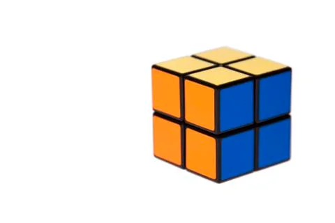 Simple small four tiles cube. Easy mind challenging puzzle on white background Stock Photos