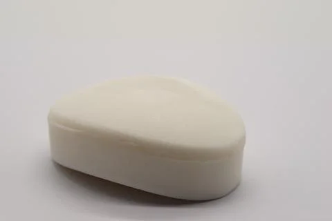 Simple soap bar rests on plain background 写真素材