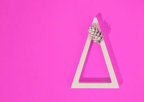 A simple solution. White wooden triangle with white pine cone. Electric pink Stock Photos