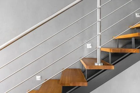 Simple staircase with chromed railing idea Stock Photos