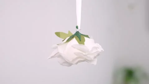 Simple steps to make a hanging flower decoration at home with paper and basic Video stock 327649581