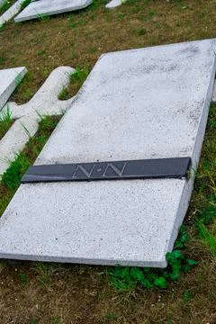Simple stone grave marked with N.N. letters, indicating an unidentified perso Stock Photos