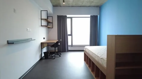 Simple student-style dorm bedroom. Hostel dormitory room. Campus Vidéo 283812082