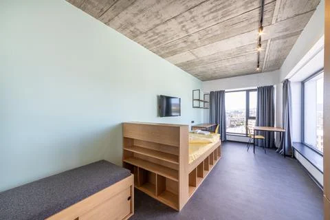 Simple student-style dorm bedroom. Hostel dormitory room. Campus Stock-Fotos