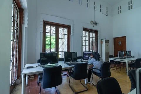 Simple Study Room with Chairs and Desks Stock Photos