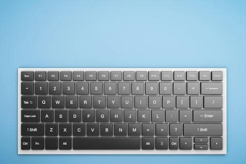 Simple stylish wireless computer keyboard on the table. View from above. Foto stock