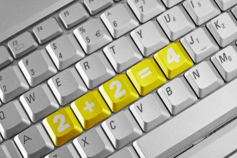 Simple sum on the computer keyboard Stock Photos