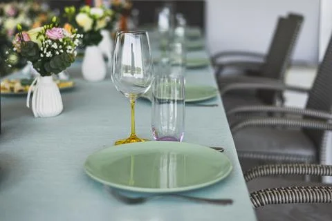 Simple table setting on green background Stock Photos