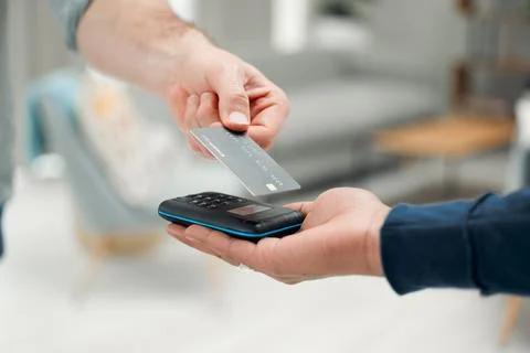 As simple as a tap. Closeup shot of an unrecognizable man paying his bills via Stock Photos
