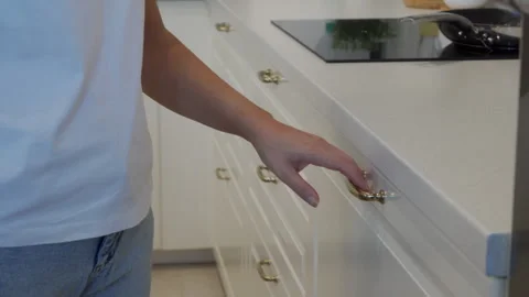 A Simple Task: Hand Opens and Closes a Kitchen Drawer in a Tidy Home. Stock Footage 320568510