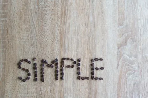 Simple text Made Of Coffee Beans. Simplicity Concept Stock Photos