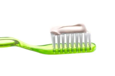 Simple Toothbrush on a White Background with Toothpaste Applied to the Bristl Stock Photos