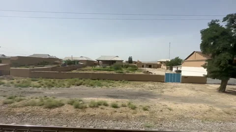 A simple train station building set in a vast rural landscape Stock Footage 317952973