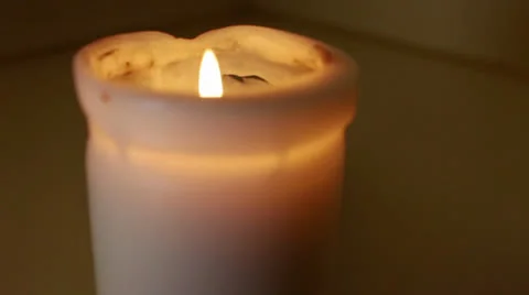 A simple white candle burning Video stock 26148881