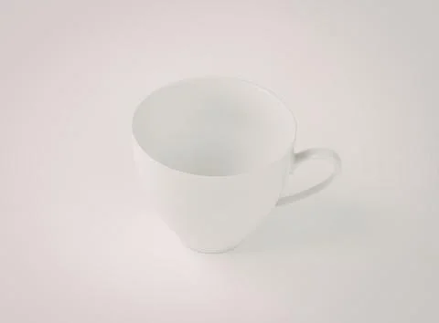 Simple white ceramic coffee cup with handle Photos