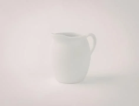 Simple white ceramic milk jug with handle Photos