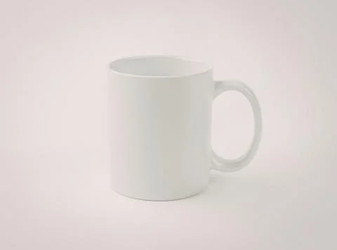 Simple white ceramic mug with handle Photos