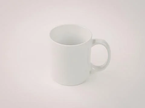 Simple white ceramic mug with handle Photos