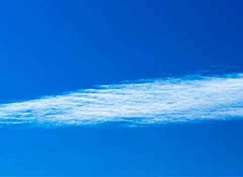 Simple white clouds in clear sky background Stock-Fotos
