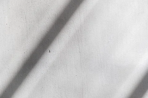 Simple white concrete wall with a dark sunlight shadow line, minimal backgr.. Stock Photos