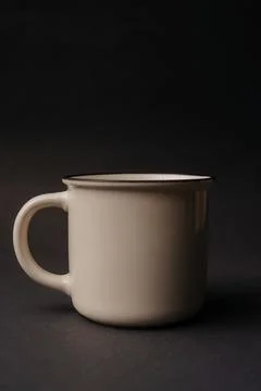 Simple white tea cup on black background Stock Photos