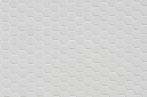 A simple white texture pattern of hexagons as a background Stock Photos
