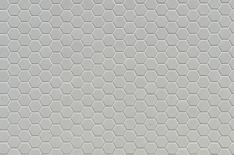 A simple white texture pattern of hexagons as a background Stock Photos