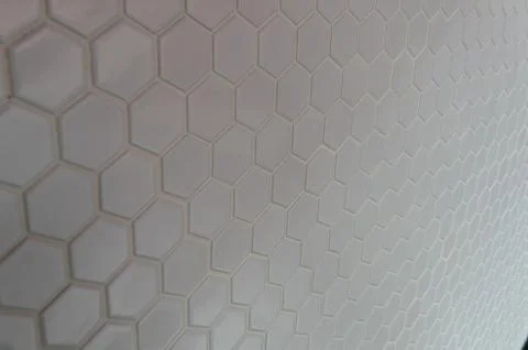 A simple white texture pattern of hexagons as a background Foto stock