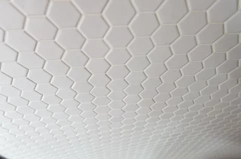 A simple white texture pattern of hexagons as a background Stock Photos