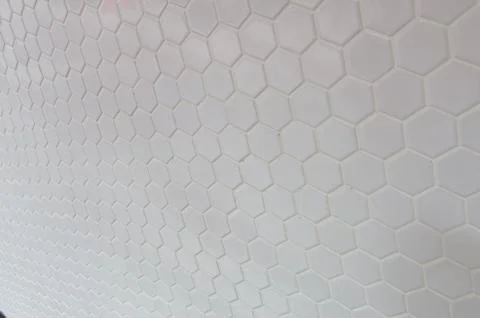 A simple white texture pattern of hexagons as a background Stock Photos