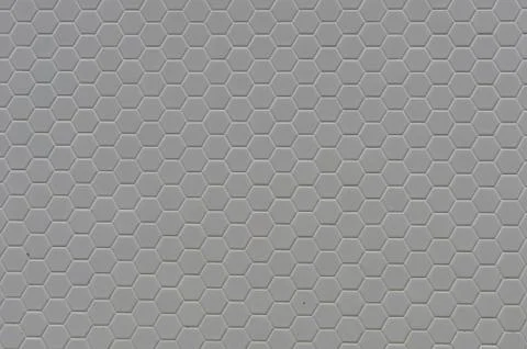 A simple white texture pattern of hexagons as a background Stock Photos